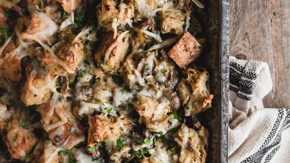 Mushroom and leek bread pudding in a casserole pan
