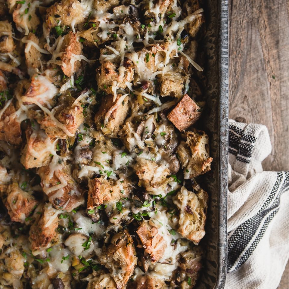 Mushroom and leek bread pudding in a casserole pan