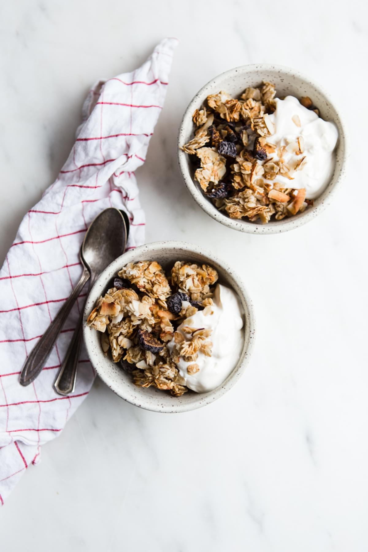 2 bowls of homemade Granola with Figs, Almonds and Coconut with yogurt