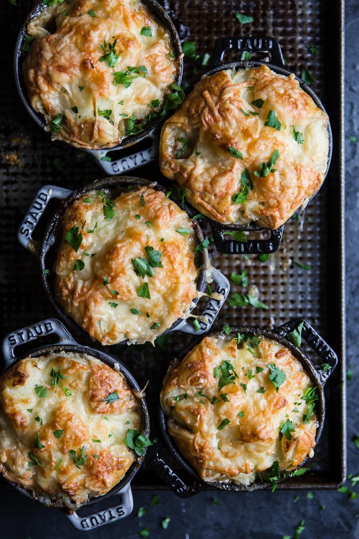 cocettes with llamb shepherd's pie with puff pastry and mashed potatoes sprinkled with gruyere cheese  with parsley