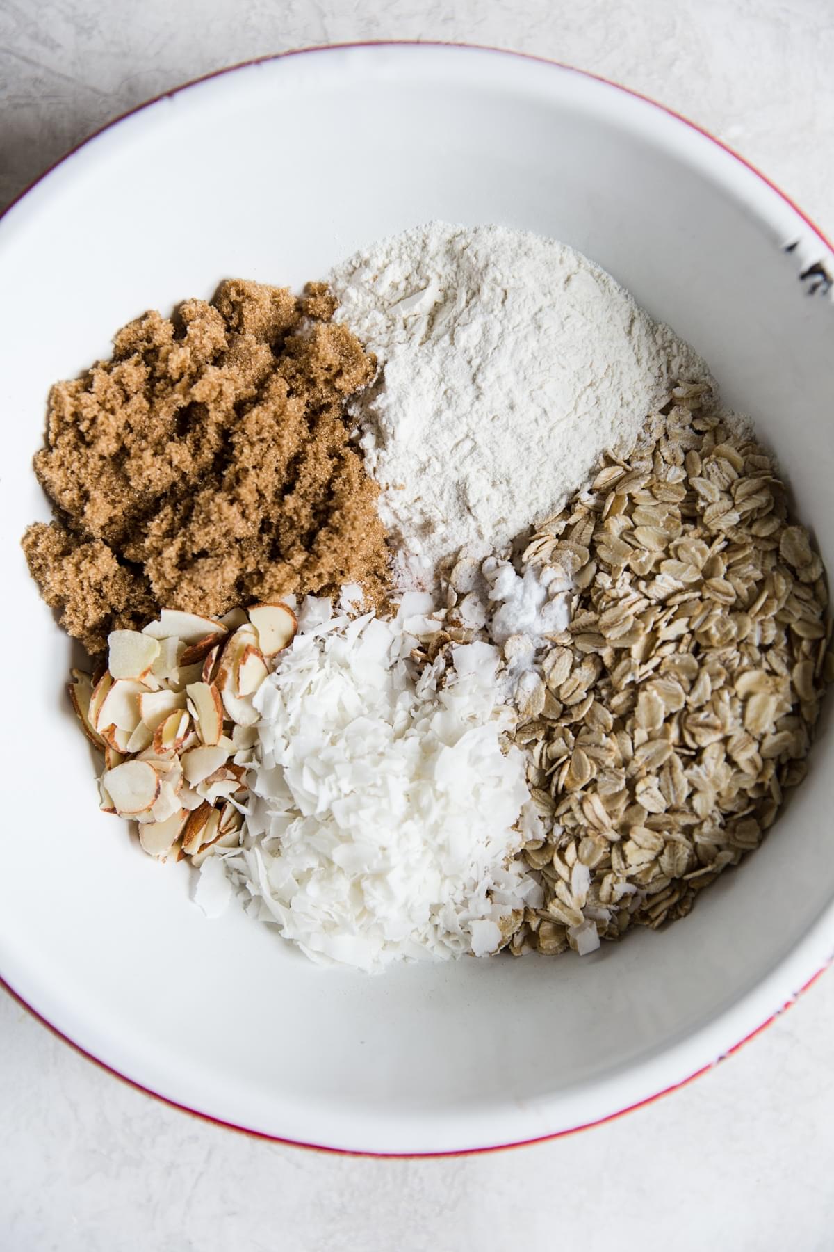 Almonds, flour, oats, shredded coconut in a bowl