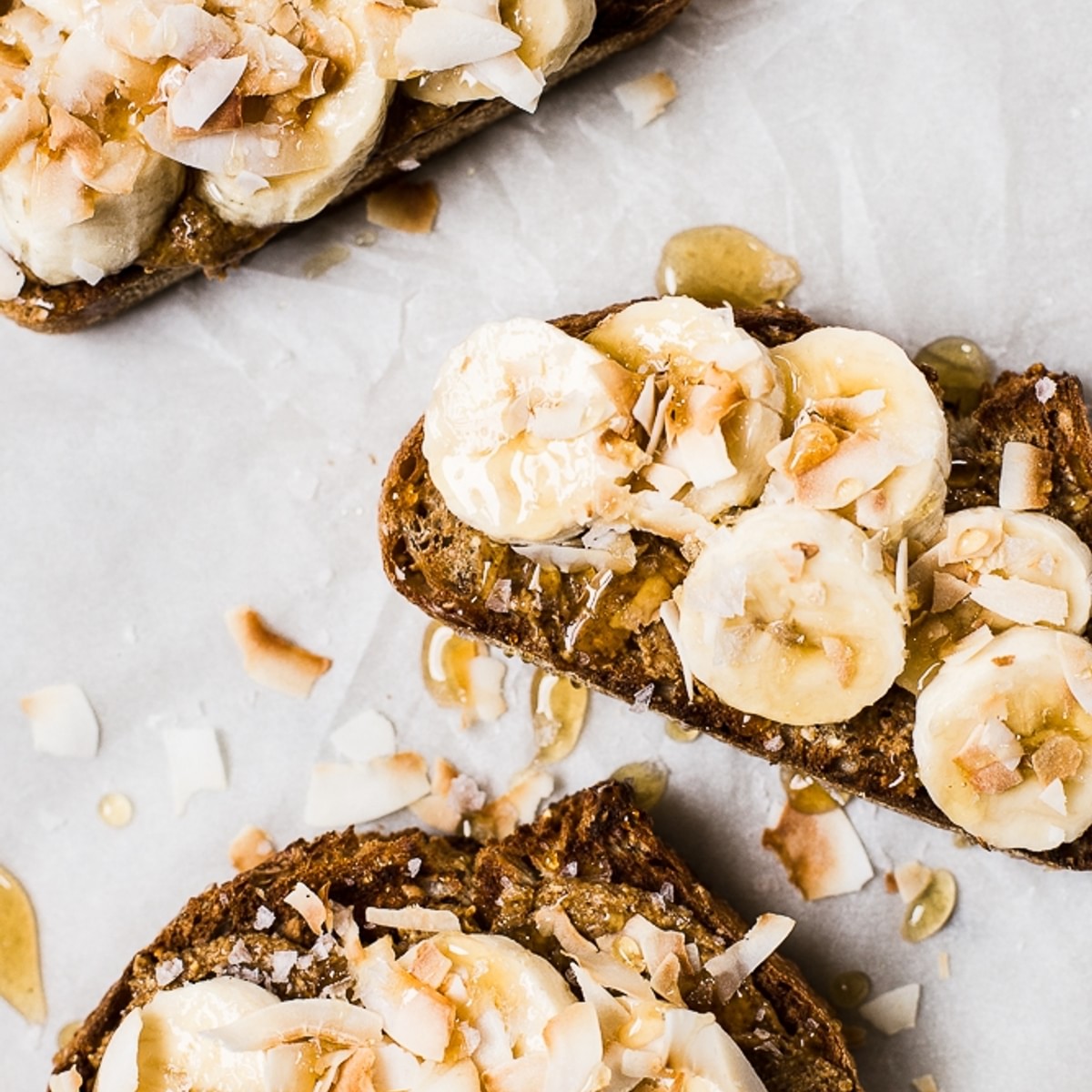 Almond Butter Toast with Bananas and Toasted Coconut and honey