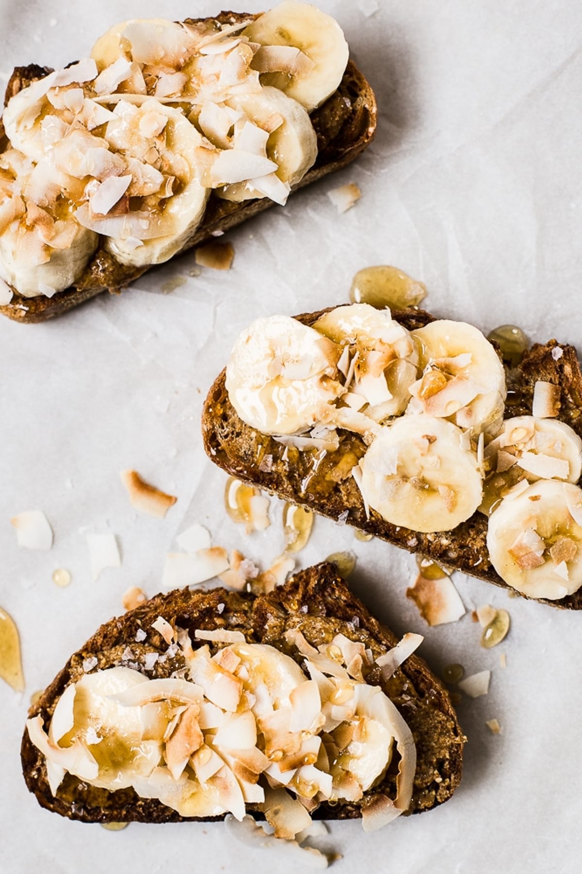 Almond Butter Toast with Bananas, Toasted Coconut, honey and flakey salt