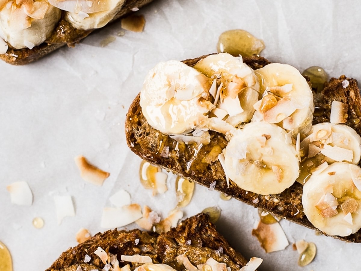Almond Butter Toast with Bananas and Toasted Coconut and honey