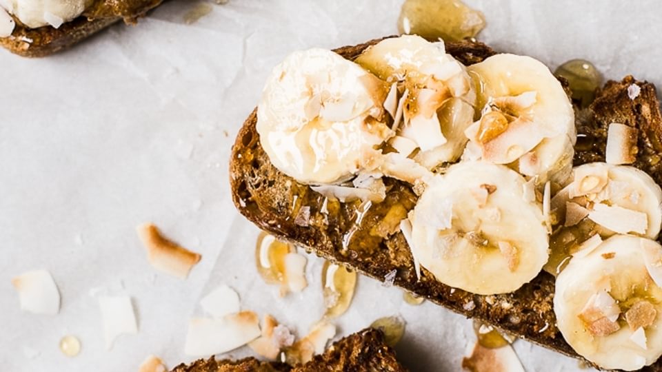 Almond Butter Toast with Bananas, Toasted Coconut, honey and flakey salt