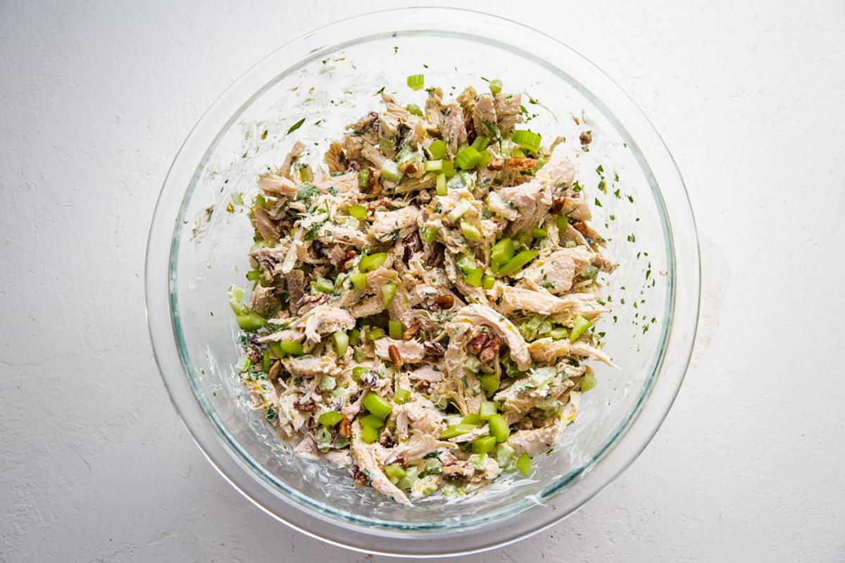 chicken salad in a bowl shredded chicken, lemon juice, tarragon, celery, pecans