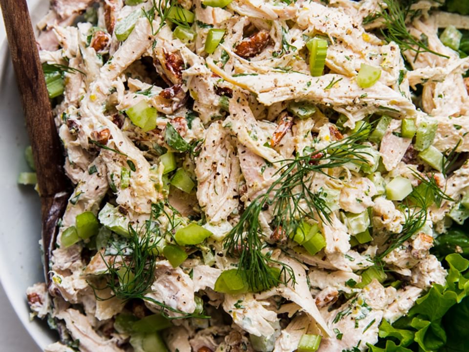classic chicken salad in a bowl with a spoon