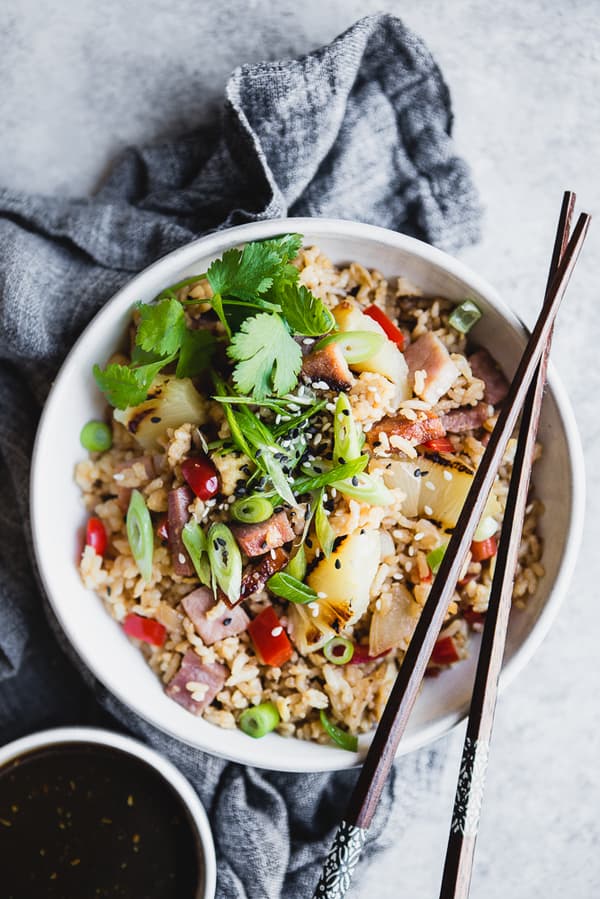 Ham and Pineapple Fried Rice in a bowl with chop sticks