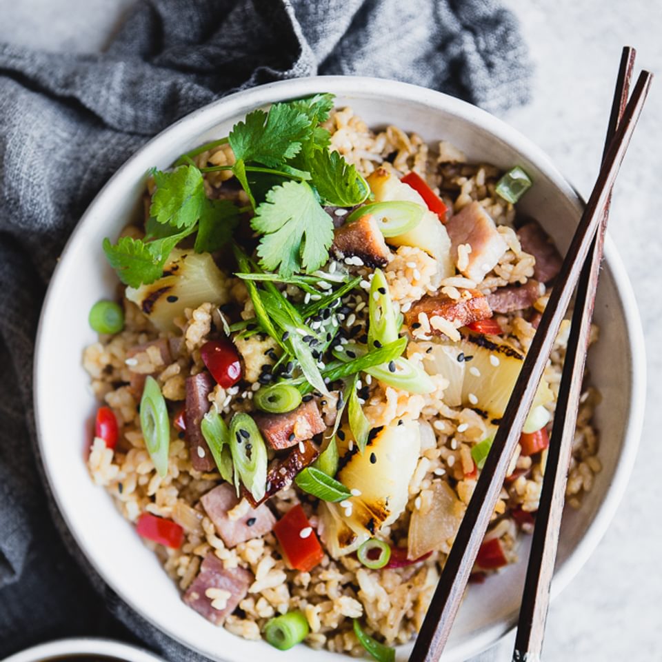 Ham and Pineapple Fried Rice in a bowl with chop sticks
