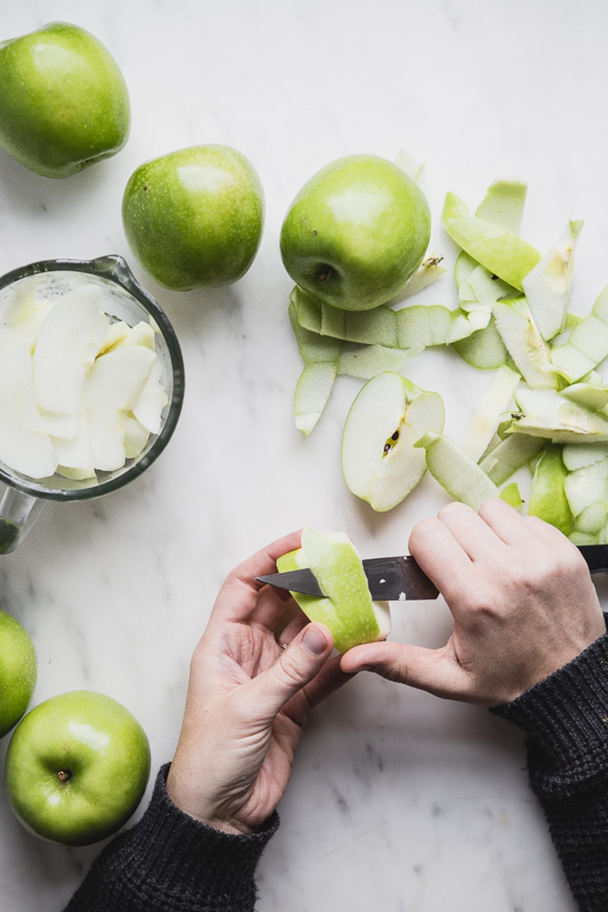 hand peeling apples for apple pie