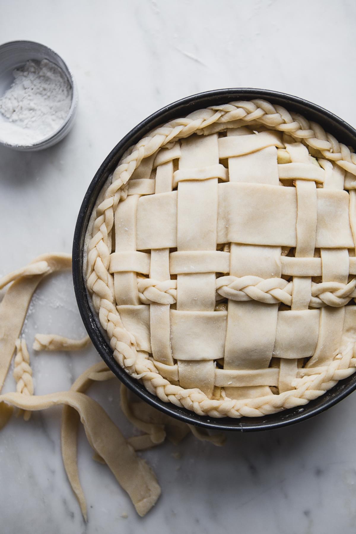 braided lattice crust on an apple pie