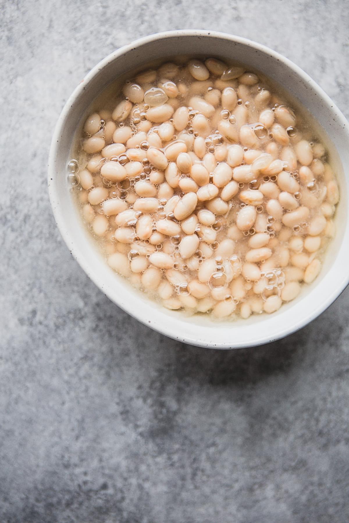 Cannellini beans in a white bowl