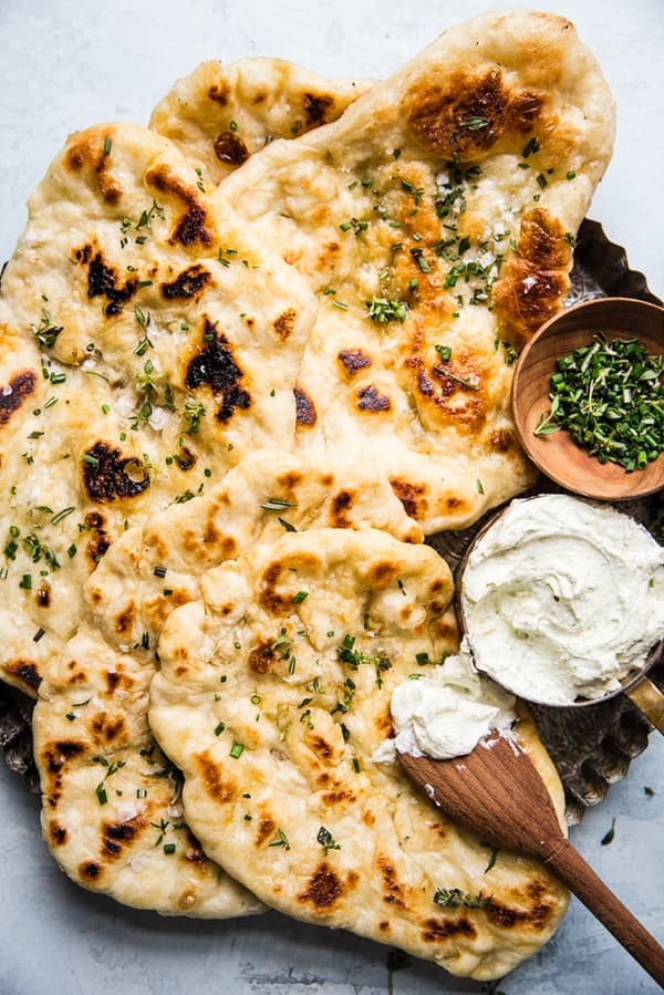 Herbed flatbread with whipped feta cheese spread in a bowl