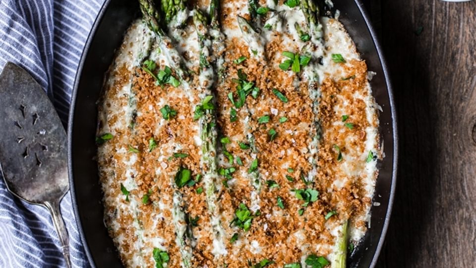 Asparagus Gratin with Gruyere Panko in a skillet