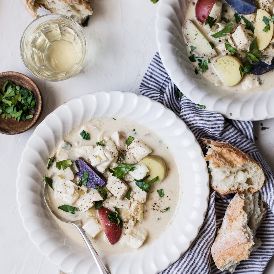 Bourride French Fish Stew with aioli and potatoes in bowls