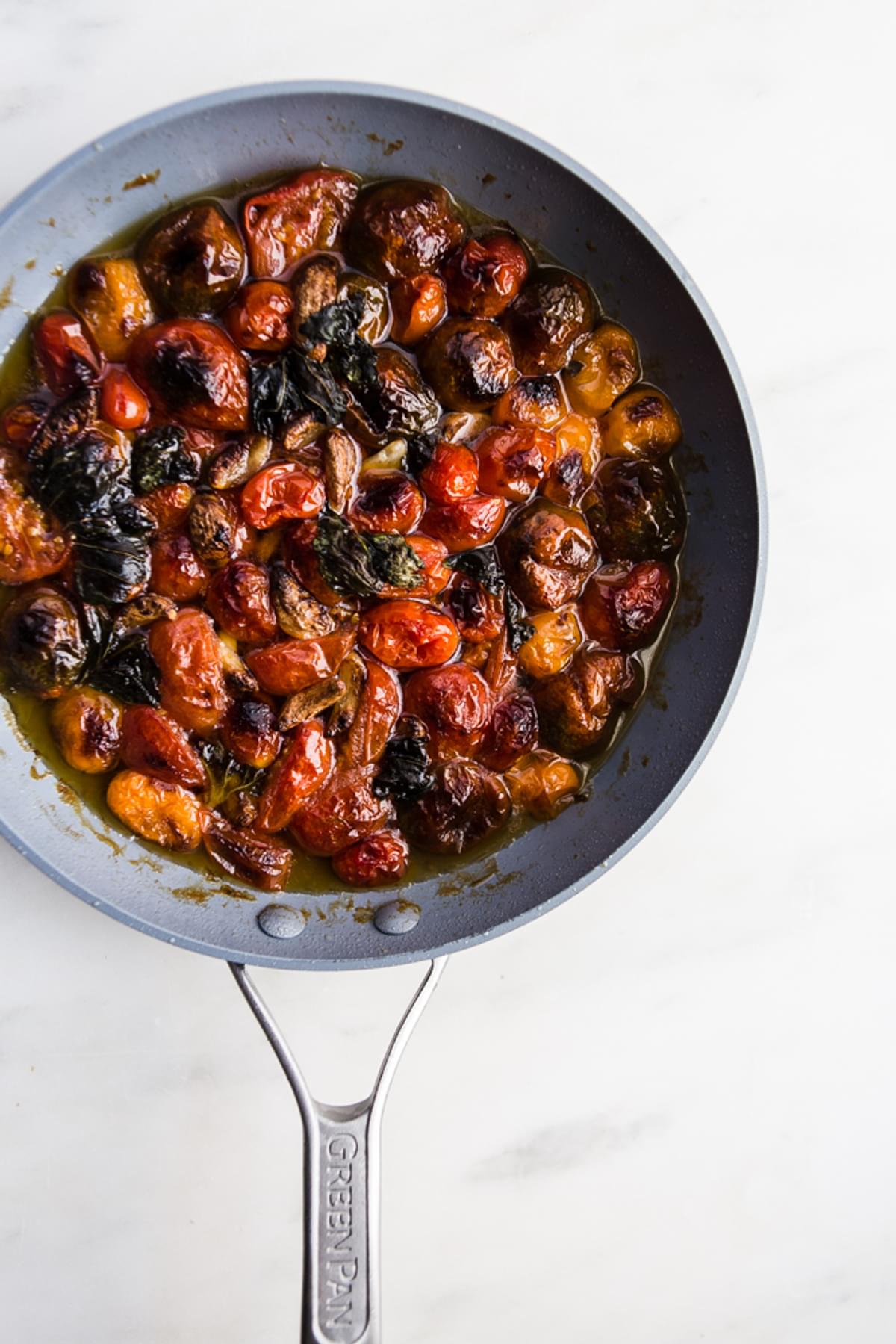 braised tomatoes in a frying pan