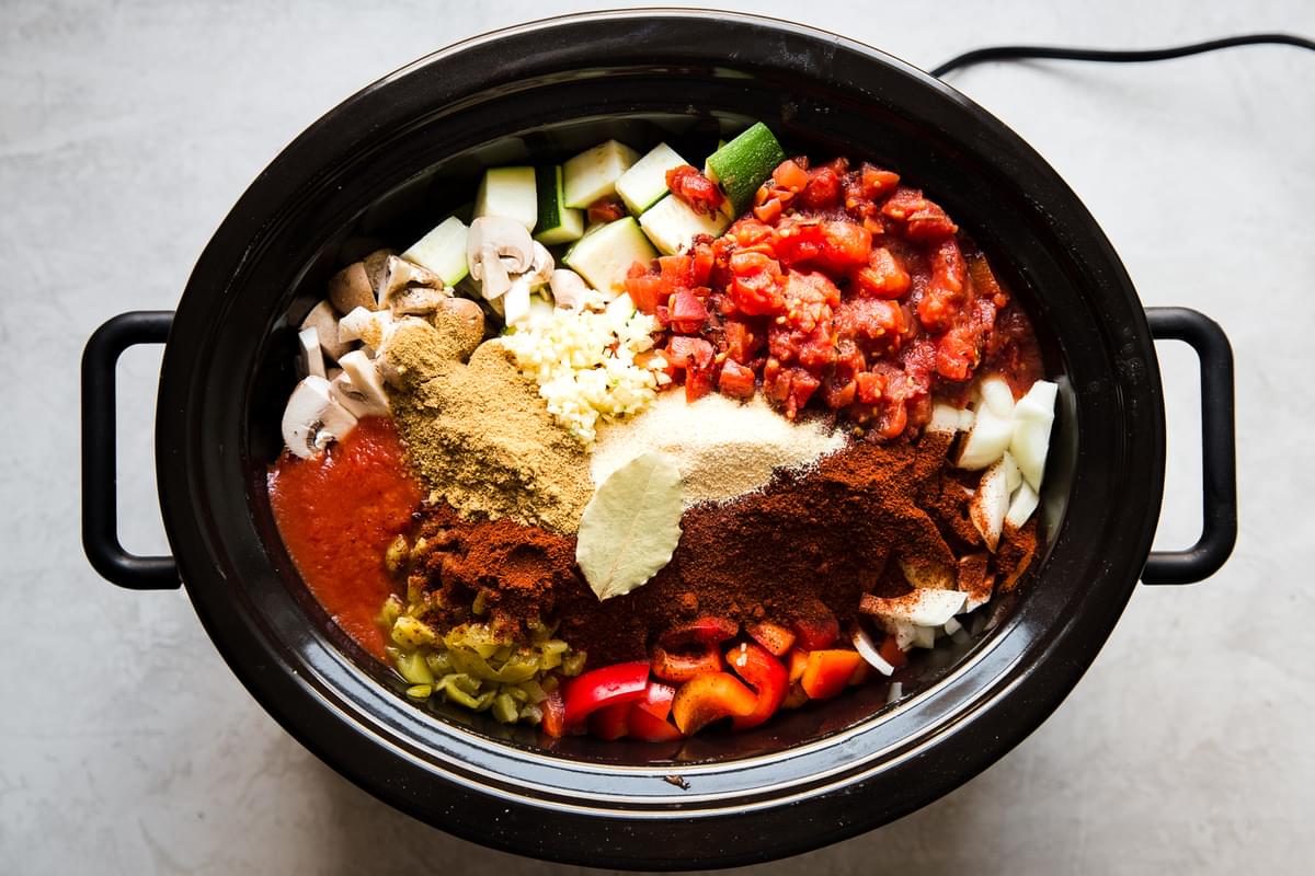 browned chuck roast, ground beef, vegetables, spices, canned tomatoes, and beef stock in a slow cooker to make paleo chili