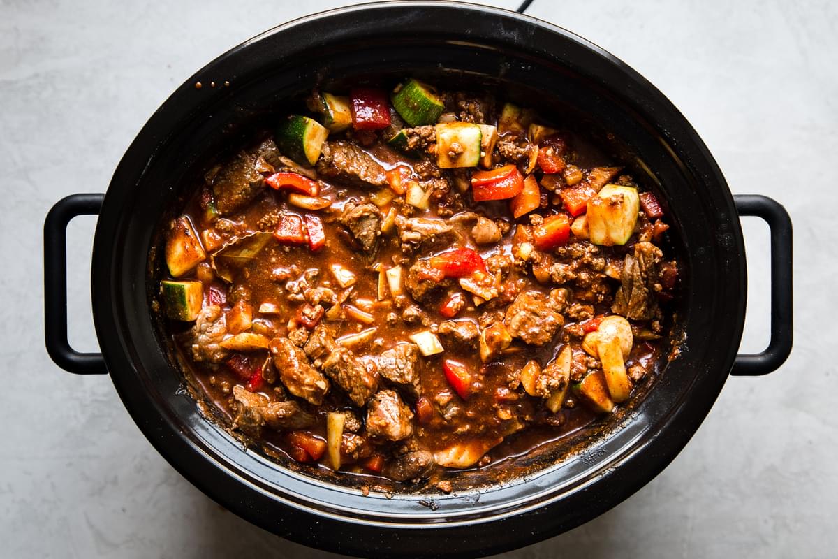 browned chuck roast, ground beef, vegetables, spices, canned tomatoes, and beef stock in a slow cooker to make paleo chili