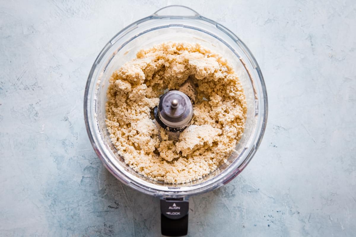 flour, butter, shortening, and salt blended together in a food processor with ice water