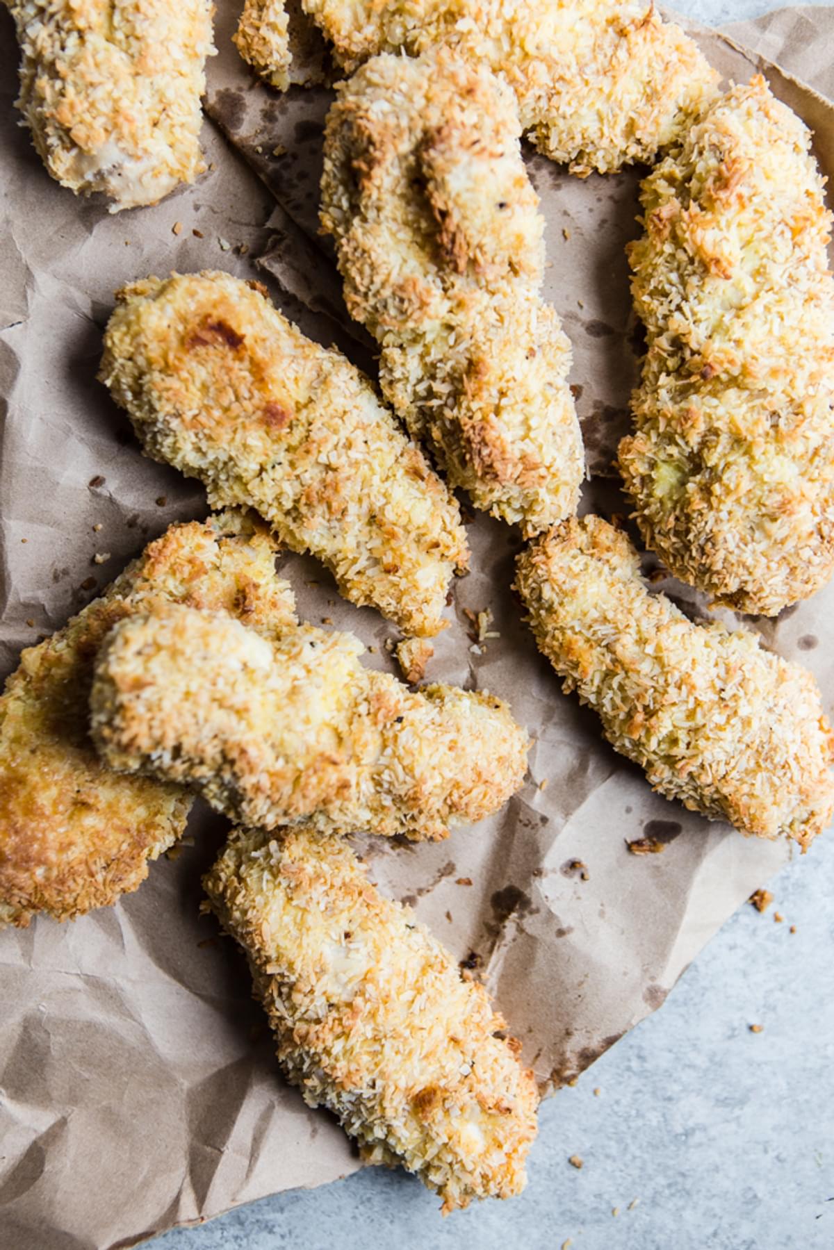 homemade baked chicken tenders on parchment paper