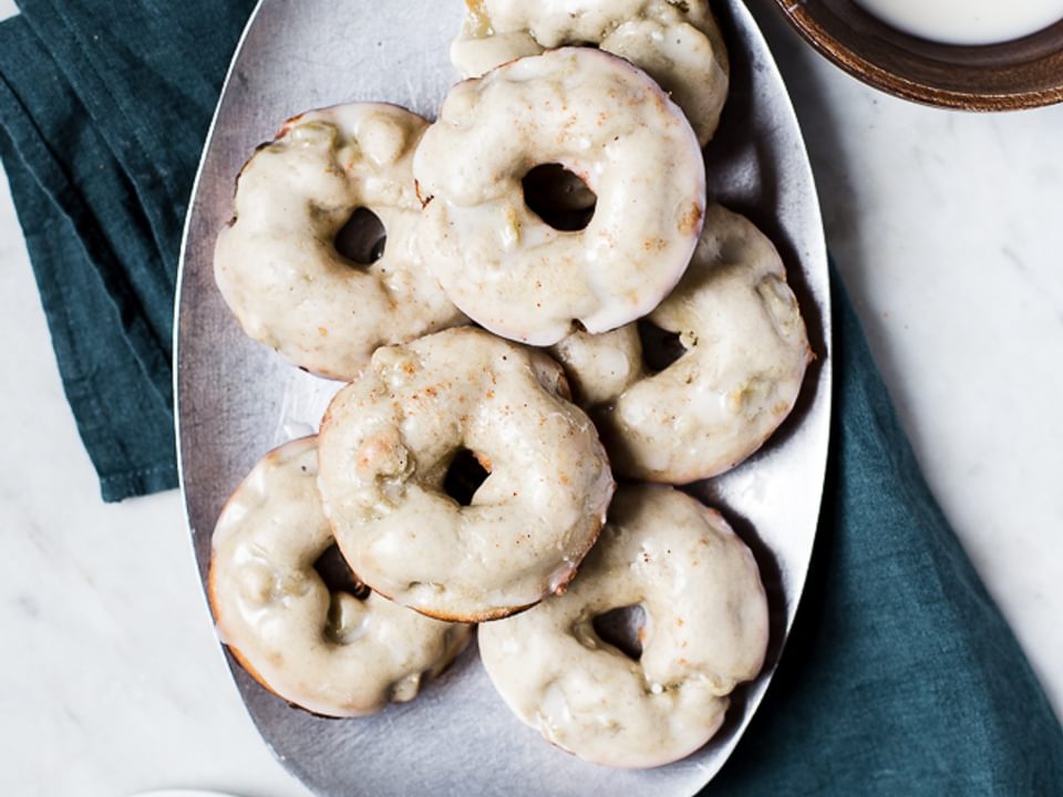 Irish Apple Cake baked Donuts with Whiskey Glaze on a plate with a linen