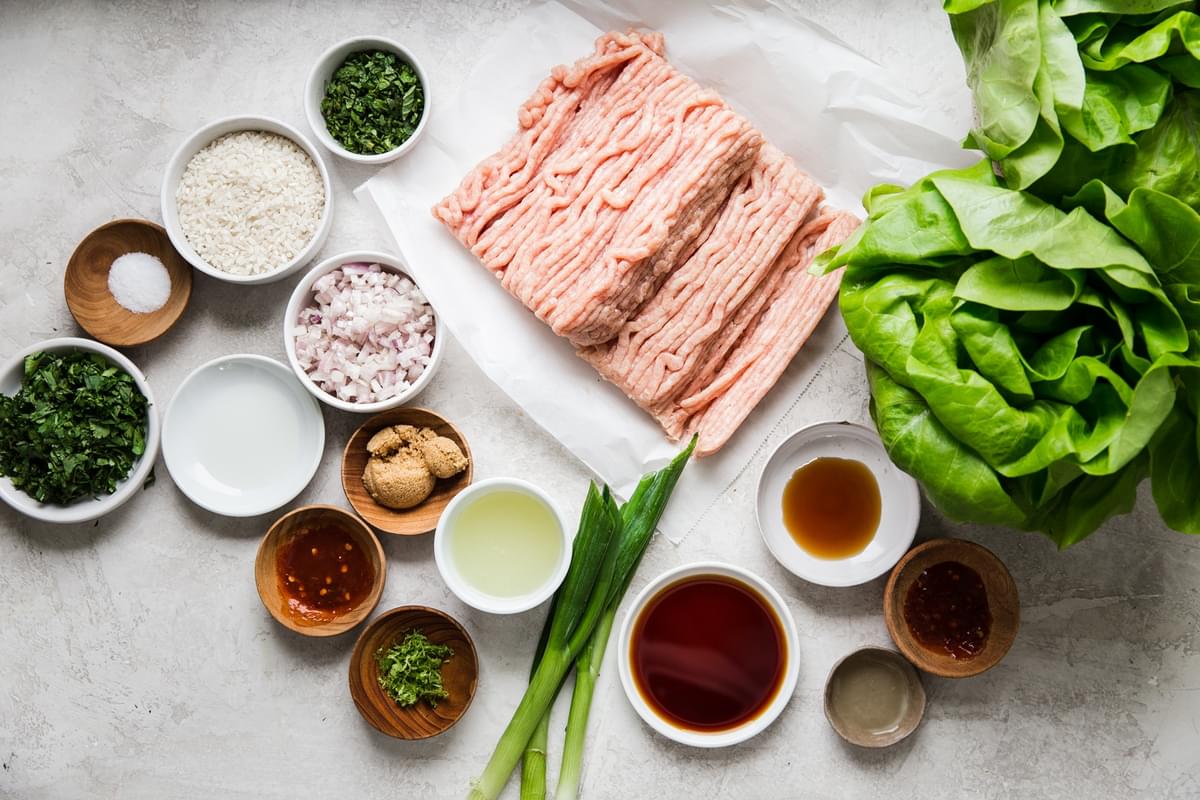 ingredients for Larb Lettuce Cups butter lettuce, ground chicken, shallots, dried rice, chili powder, mint, cilantro