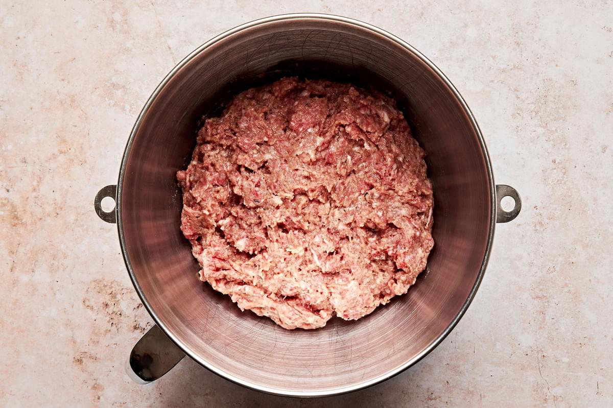 ground beef, ground pork, breadcrumbs, ketchup egg, milk and spices combined in a  mixing bowl to make mini meatloaf