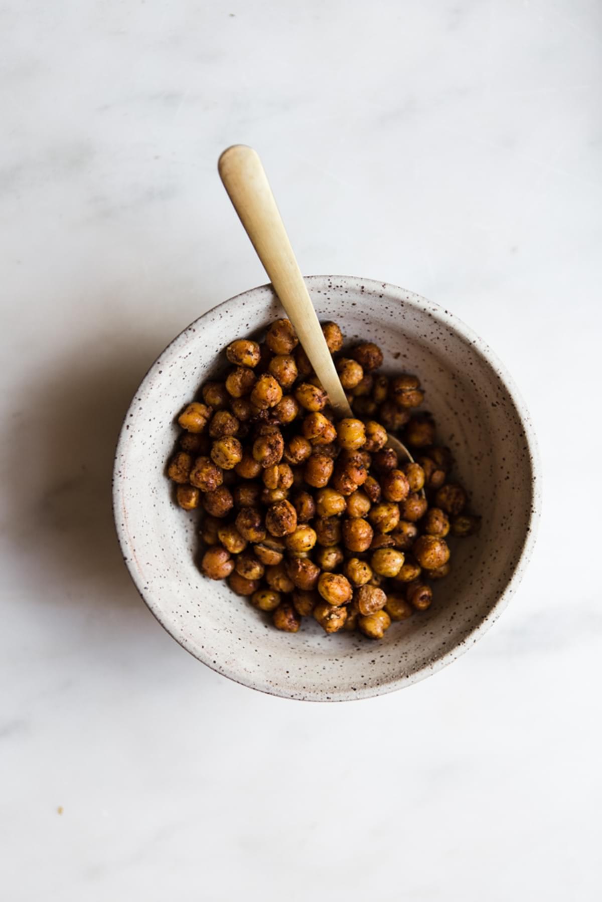 roasted chickpeas with spice in a bowl with a spoon