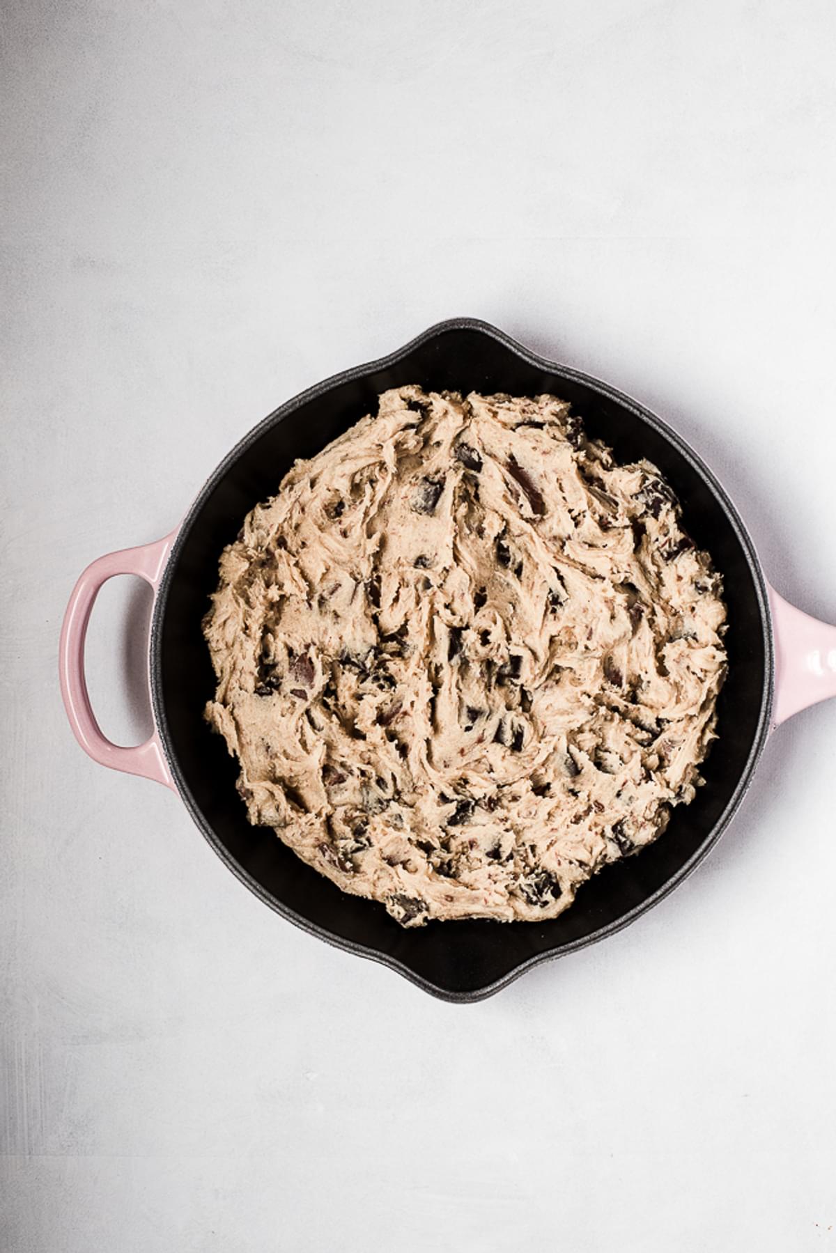 Chocolate chip Cookie dough in a cast iron skillet
