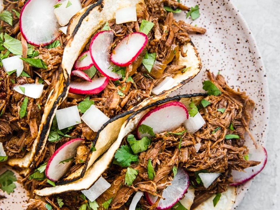Slow Cooker Barbacoa Beef Tacos on a plate