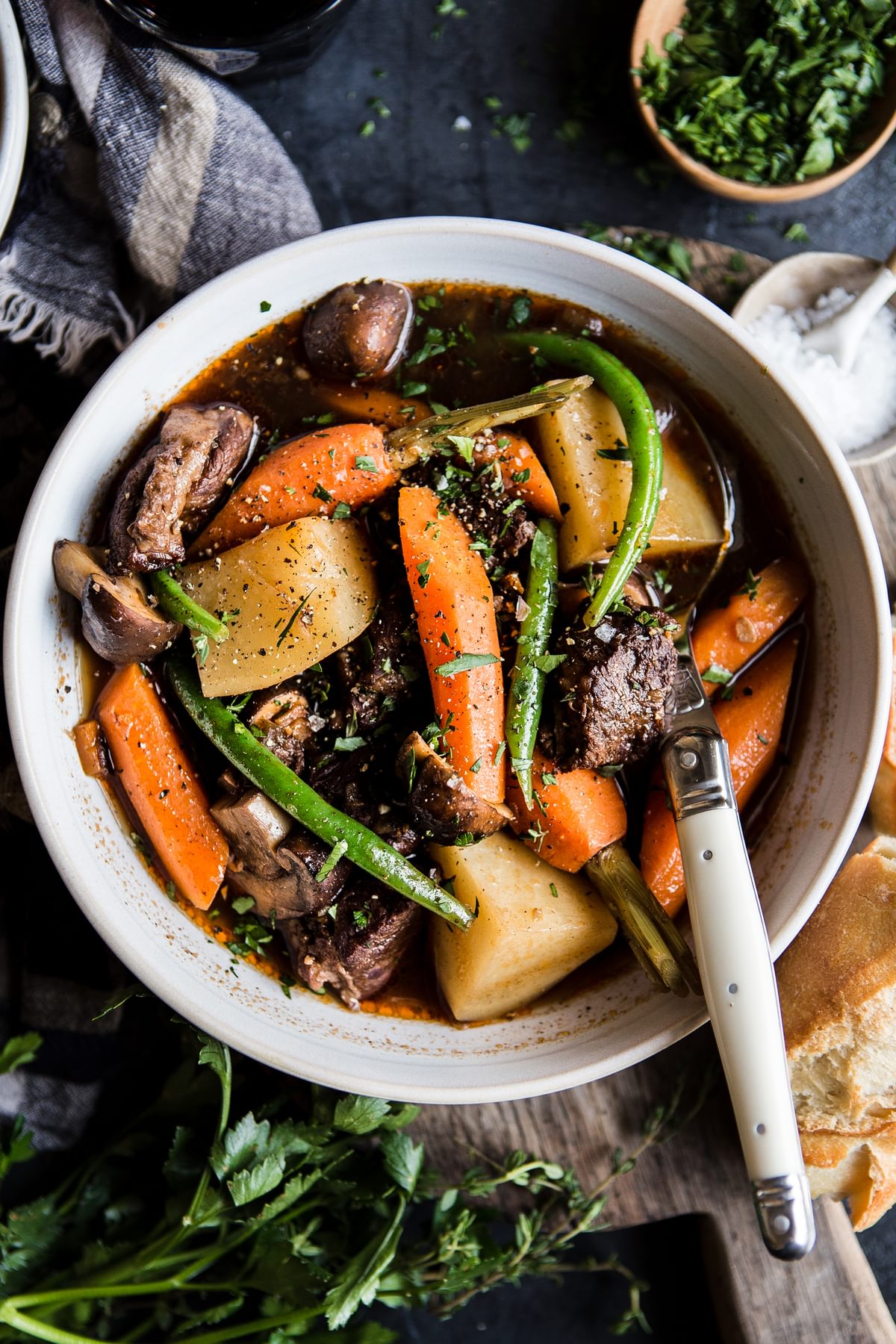 Slow Cooker Beef Stew in a bowl with carrots, green beans, mushrooms and potatoes