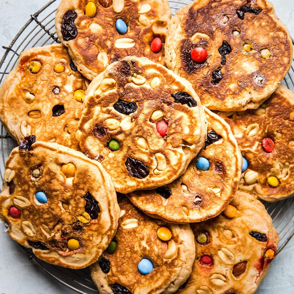 pancakes made with trail mix m&ms, peanuts and raisins