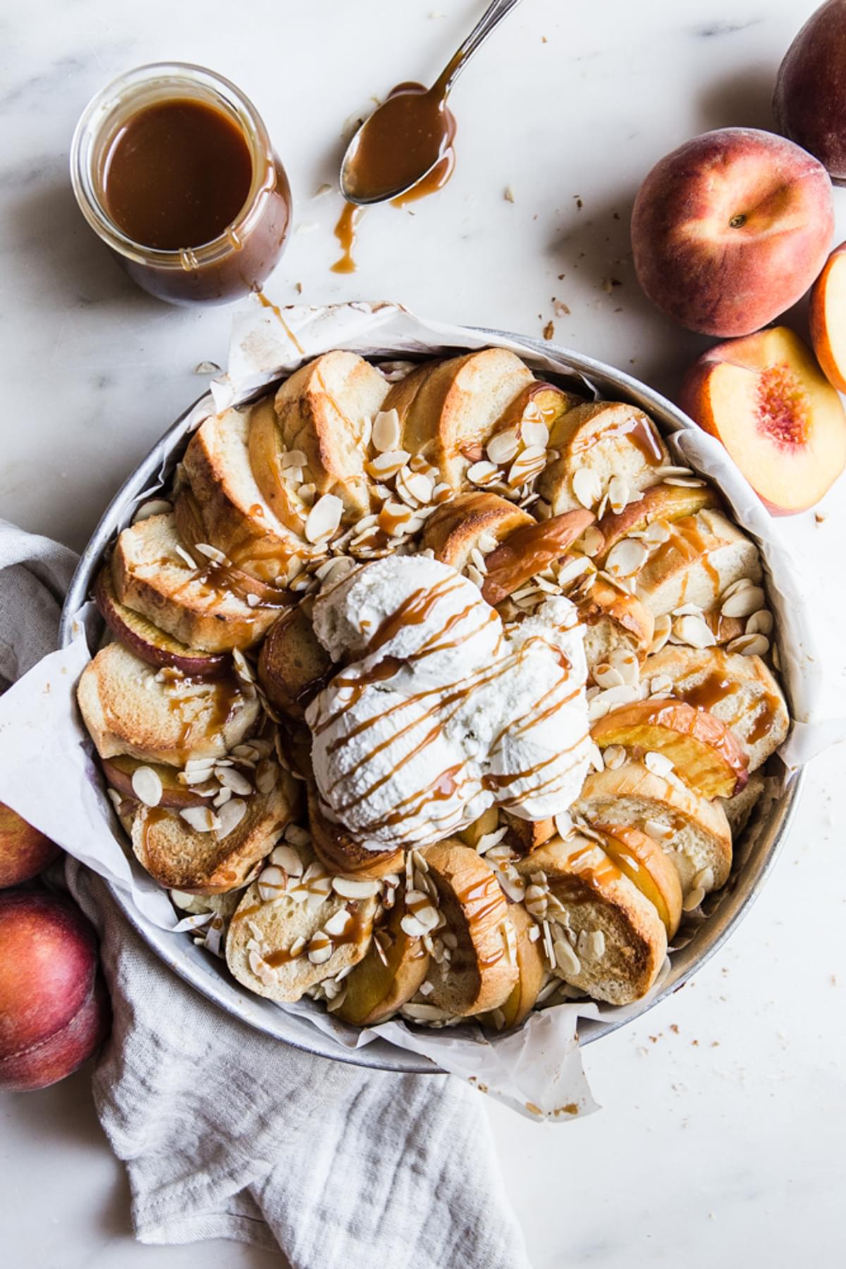 Almond Peach Bread Pudding with ice cream and caramel sauce