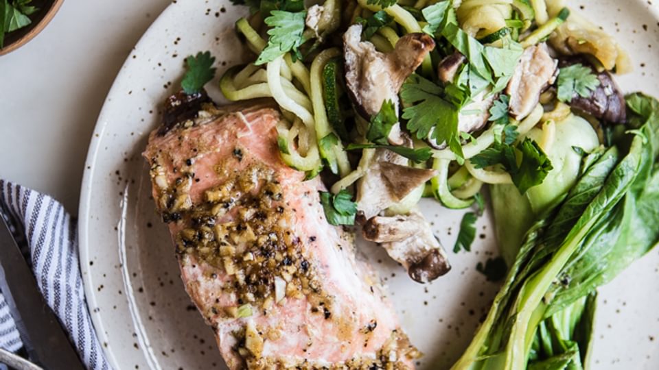 Ginger Garlic Salmon Dinner in parchment paper with zucchini noodles