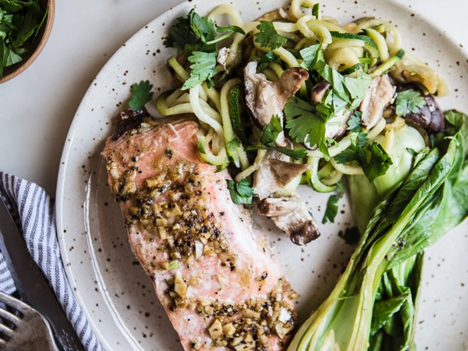 Ginger Garlic Salmon Dinner in parchment paper with zucchini noodles