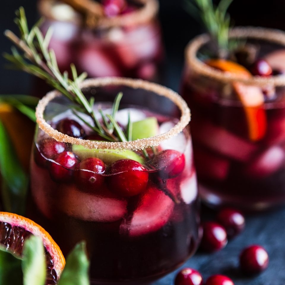 red sangria with cranberries, orange, cinnamon and rosemary
