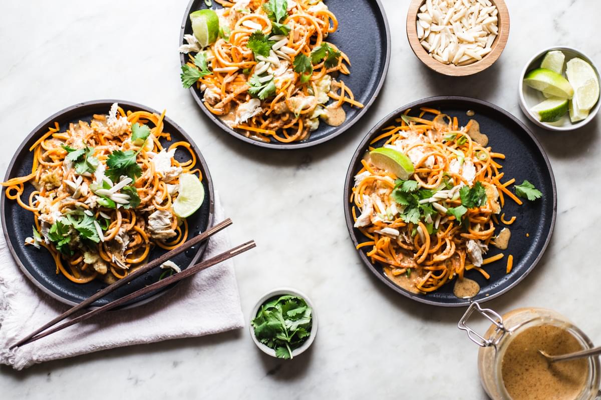 homemade Pad Thai made with sweet potato noodles with cilantro and lime on a plate
