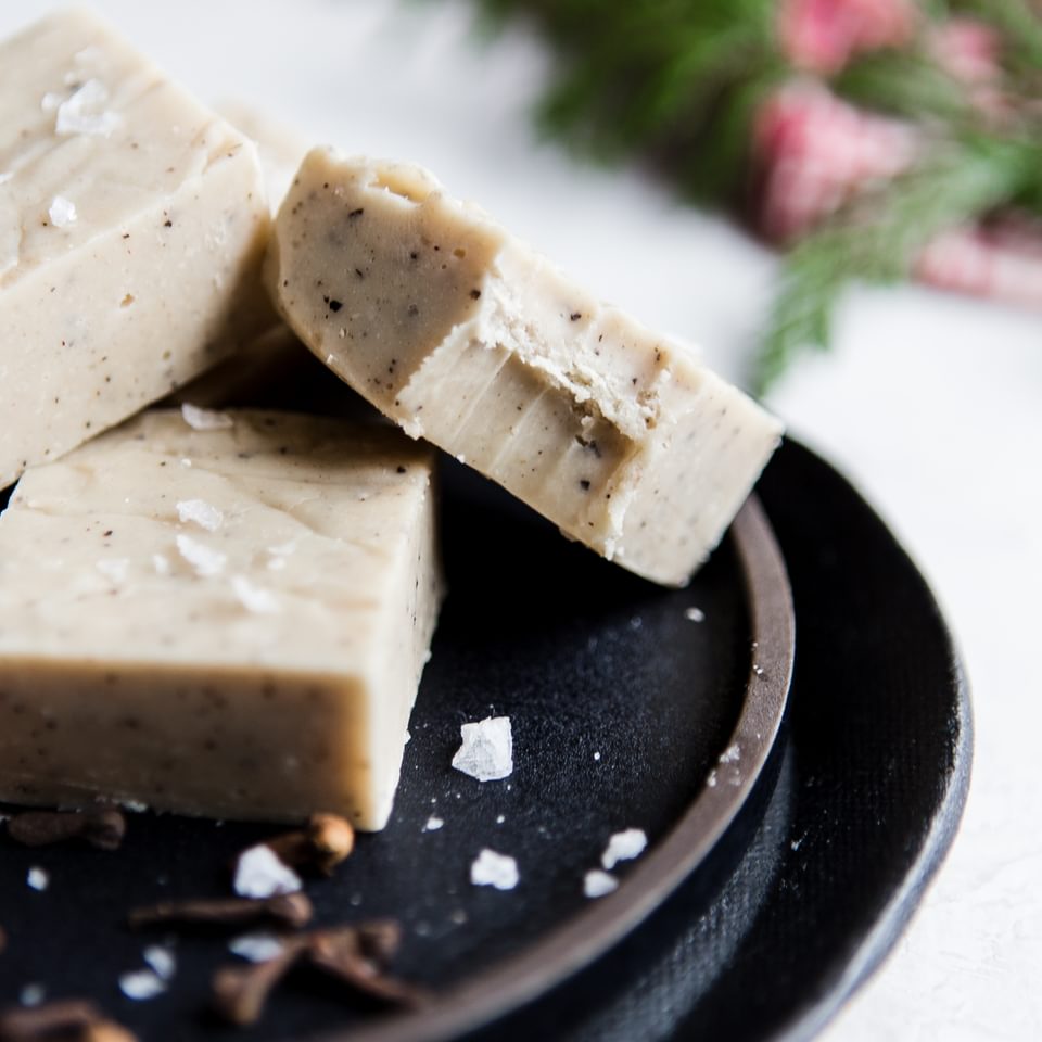 3 squares of white chocolate chai fudge on a plate