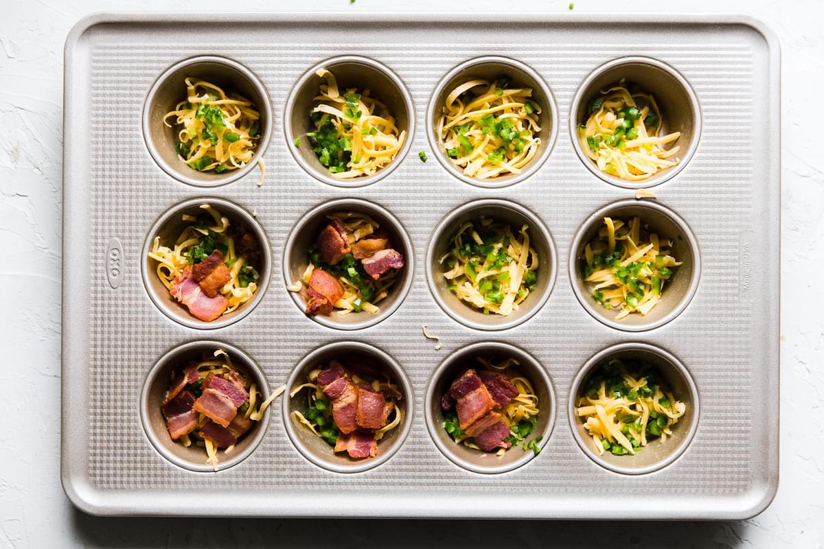 bacon cheese cilantro jalapeño in a muffin tin for egg cups