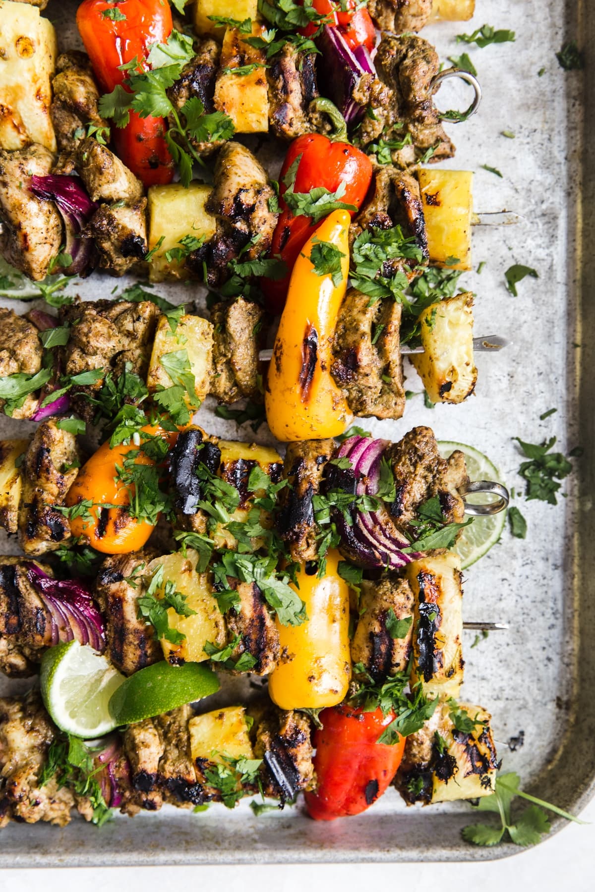 grilled jerk chicken kebabs with pineapple bell peppers limes and cilantro