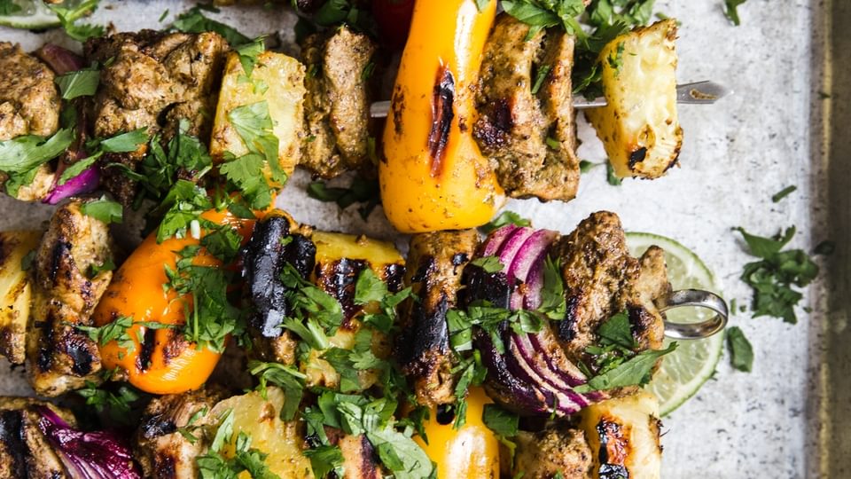 grilled jerk chicken kebabs with pineapple bell peppers limes and cilantro