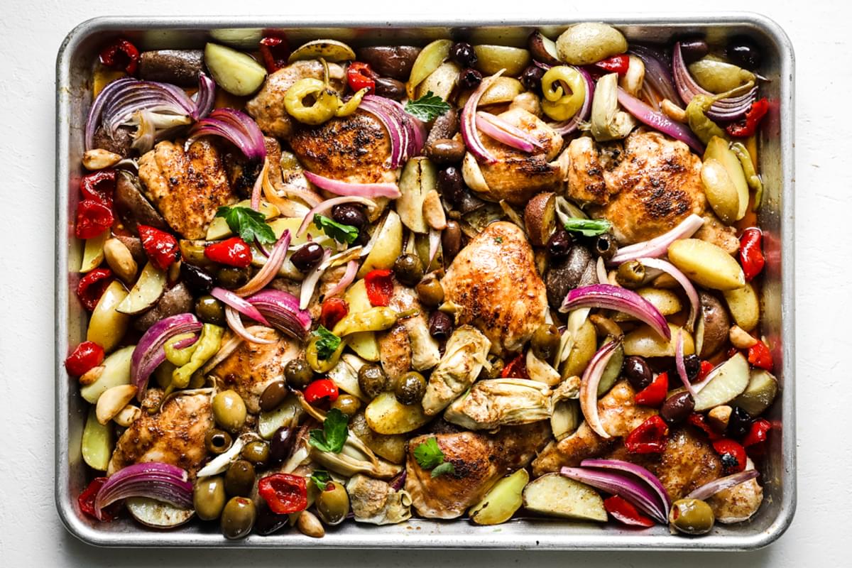 Olive Bar Sheet pan Chicken dinner garnished with parsley