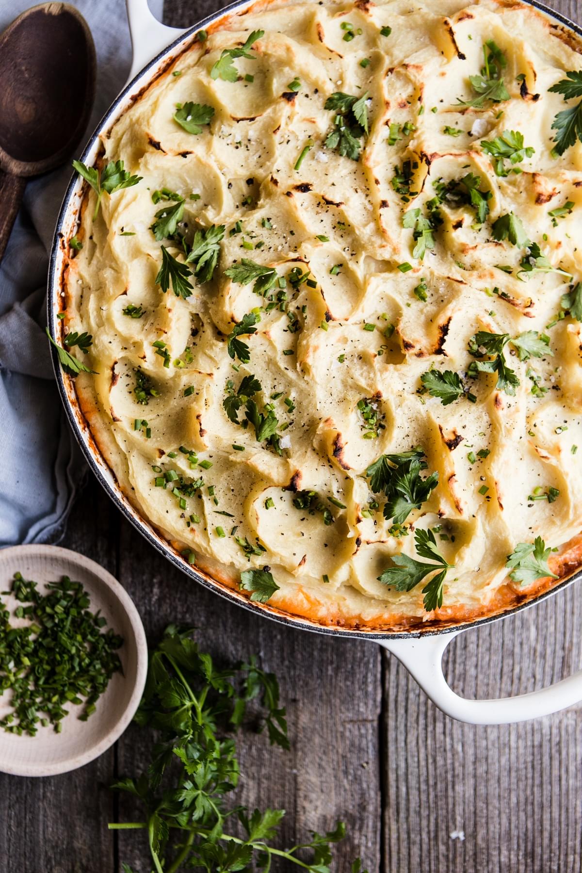 Paleo and Whole Shepherds Pie on a table with parsley