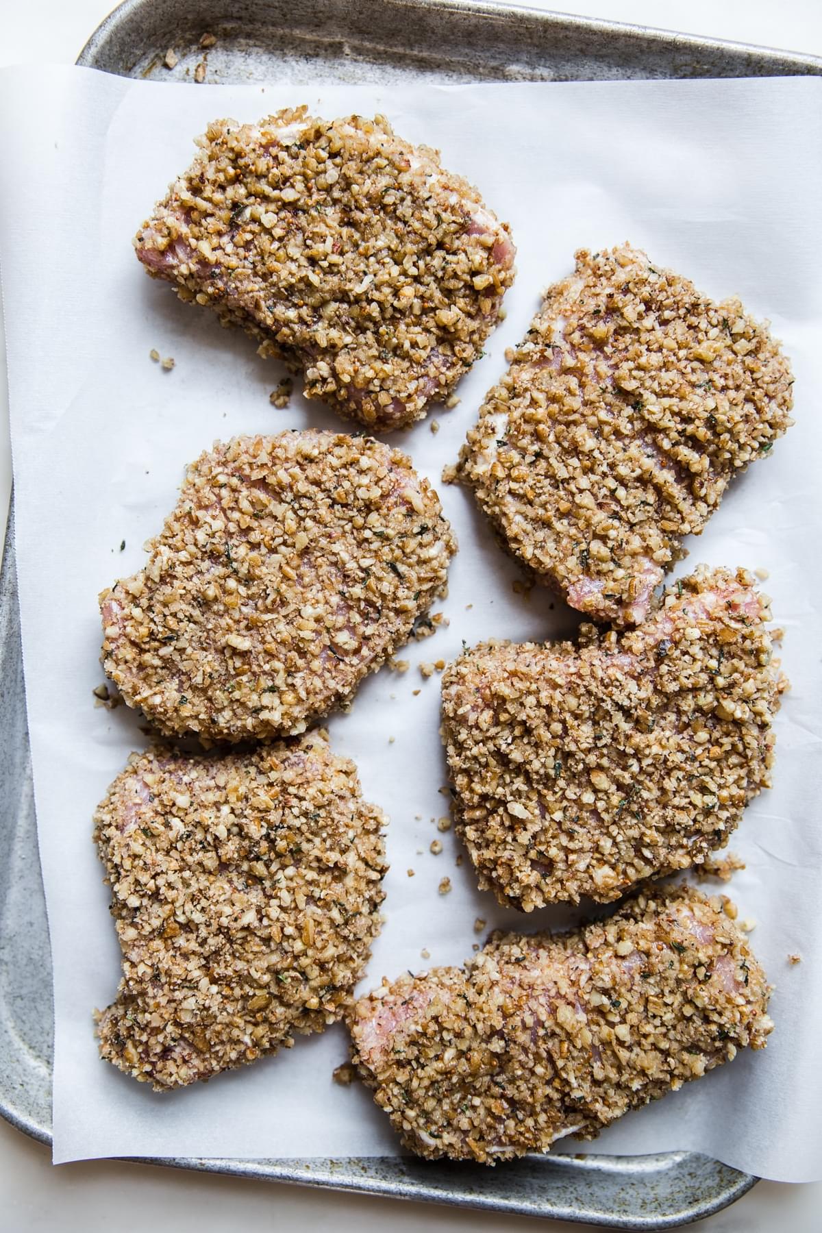 Pecan Crusted Pork Chops on parchment paper
