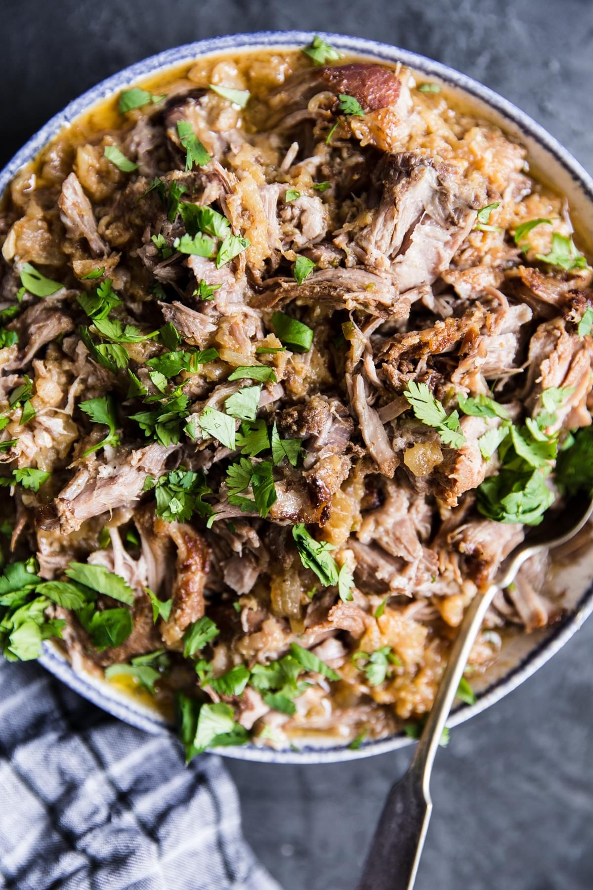 slow cooker pineapple pulled pork in a serving bowl