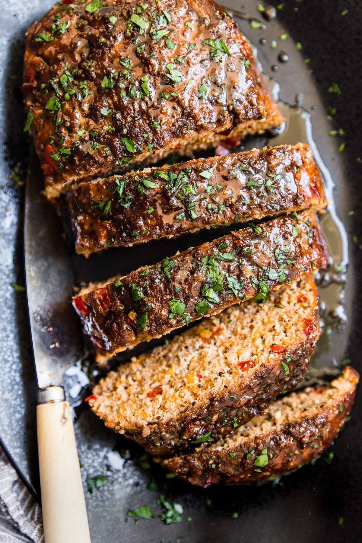 Turkey quinoa meatloaf cut into slices on a plater