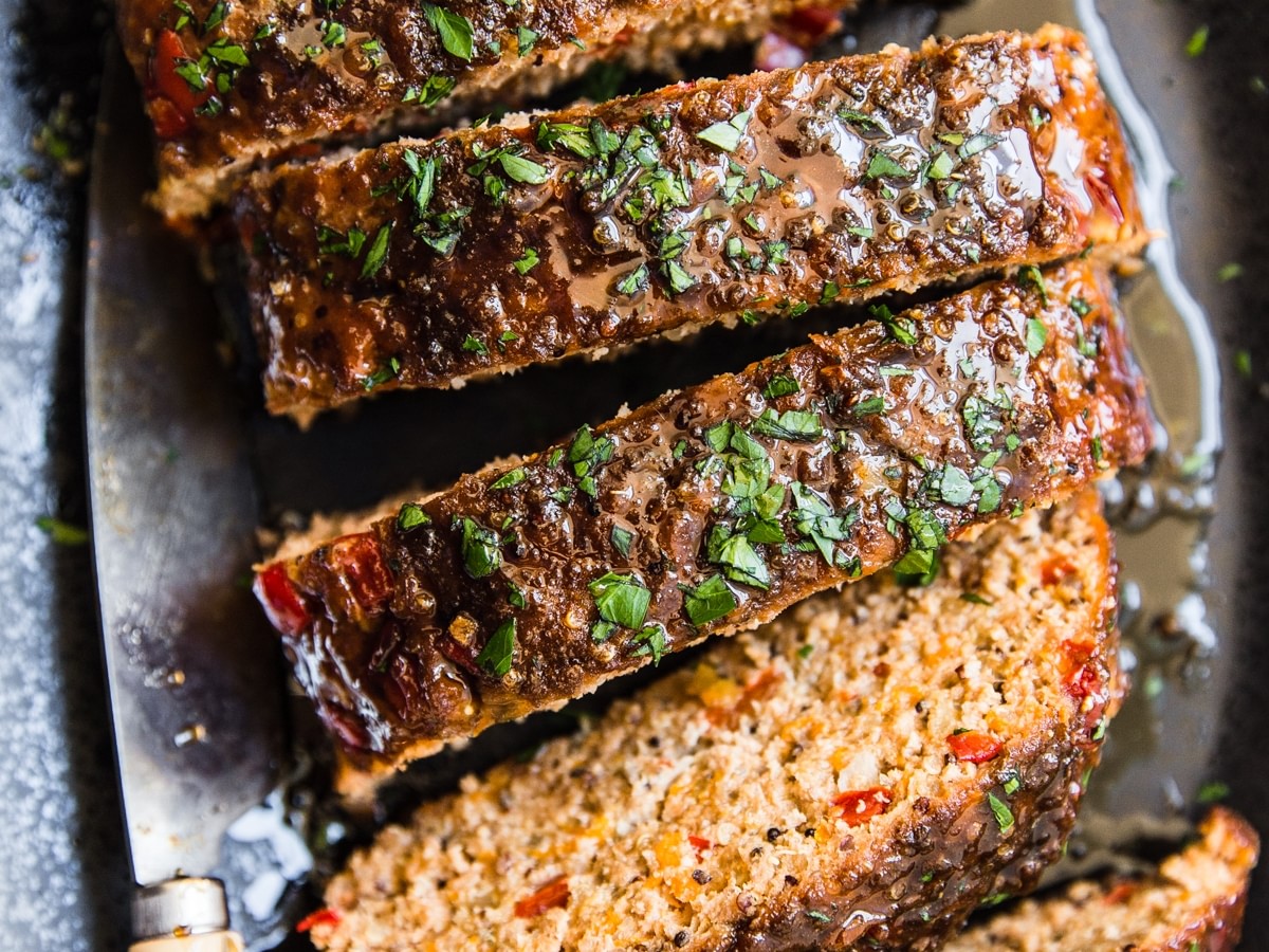 Turkey quinoa meatloaf cut into slices on a plater