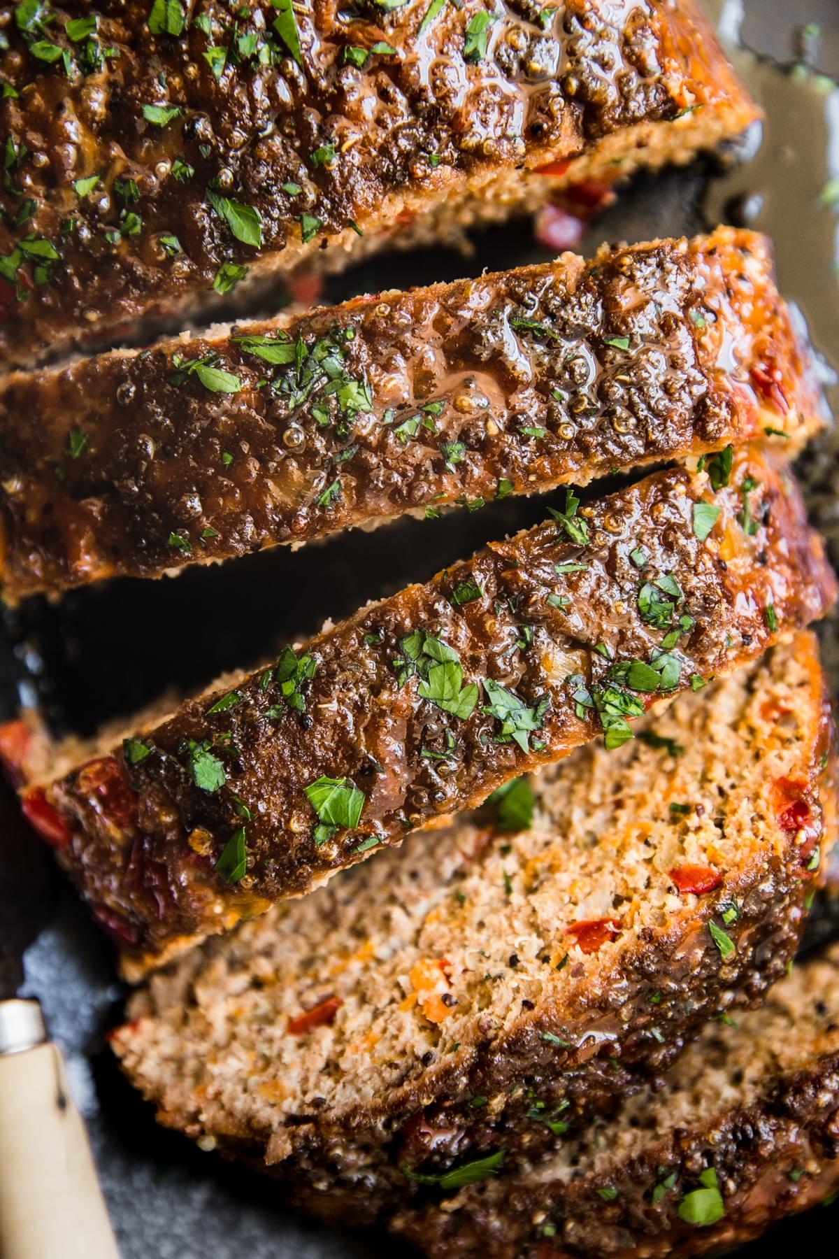 Turkey Quinoa Meatloaf sliced to see close up ingredients