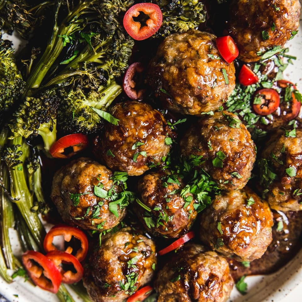 Baked Teriyaki Meatballs With Roasted Broccoli on a plate
