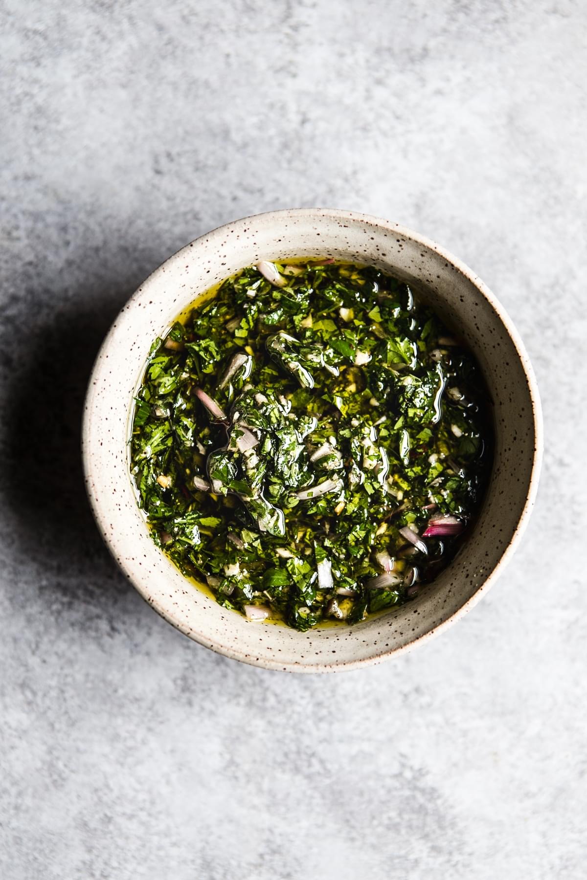 A small bowl of Chimichurri sauce